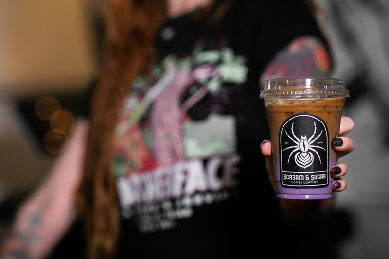 Nic Johnson show off her Something Wicked iced latte.