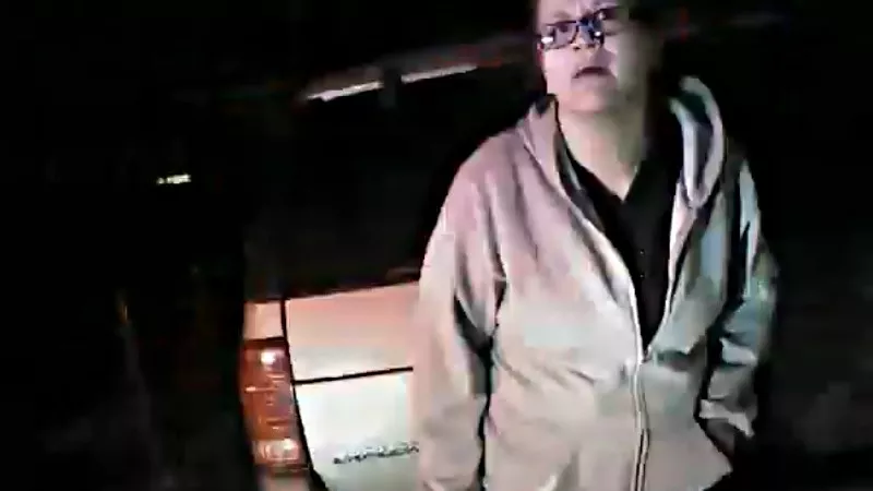 Image: Kristyn Stonskas seconds before being tackled to the ground by Denver Police officers.