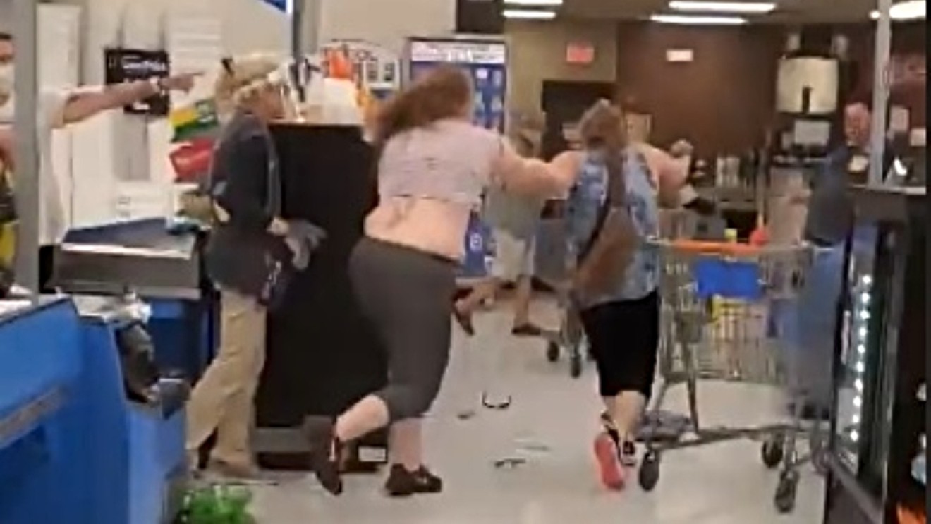 A screen capture from video of a fight over social distancing at a Colorado Springs Walmart on July 30.