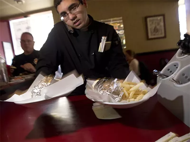 Image: Obeid Kaifo multi-tasking at the Shish Kabab Grill.