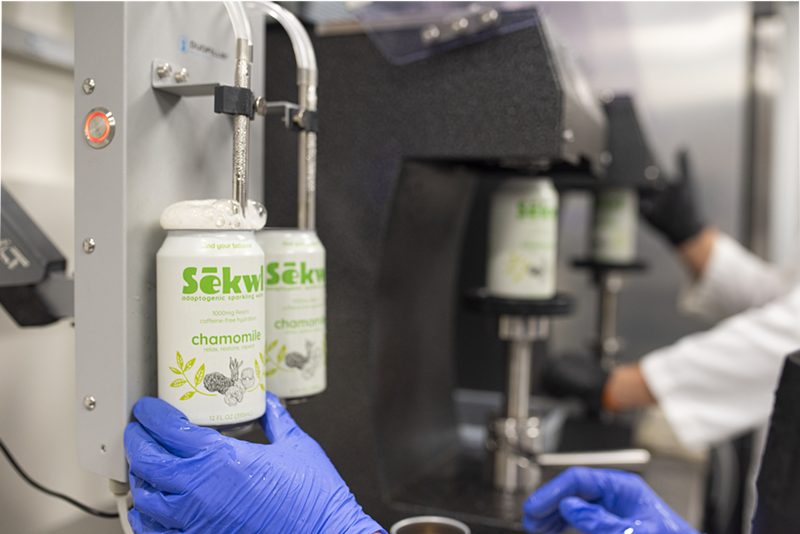 Image: Chamomile and reishi sparkling water being canned at Sēkwl