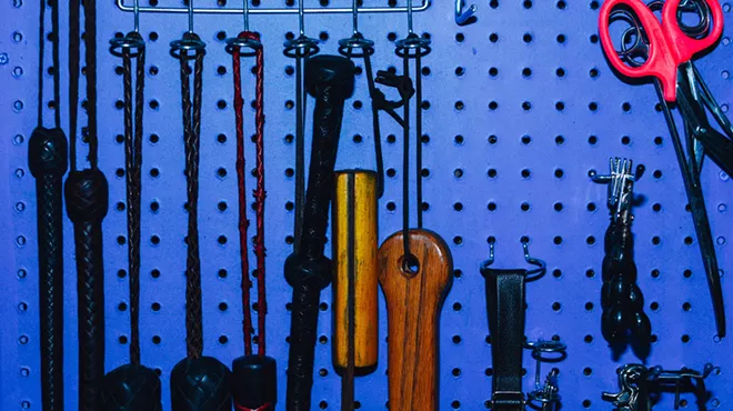 wall of BDSM gear and sex toys
