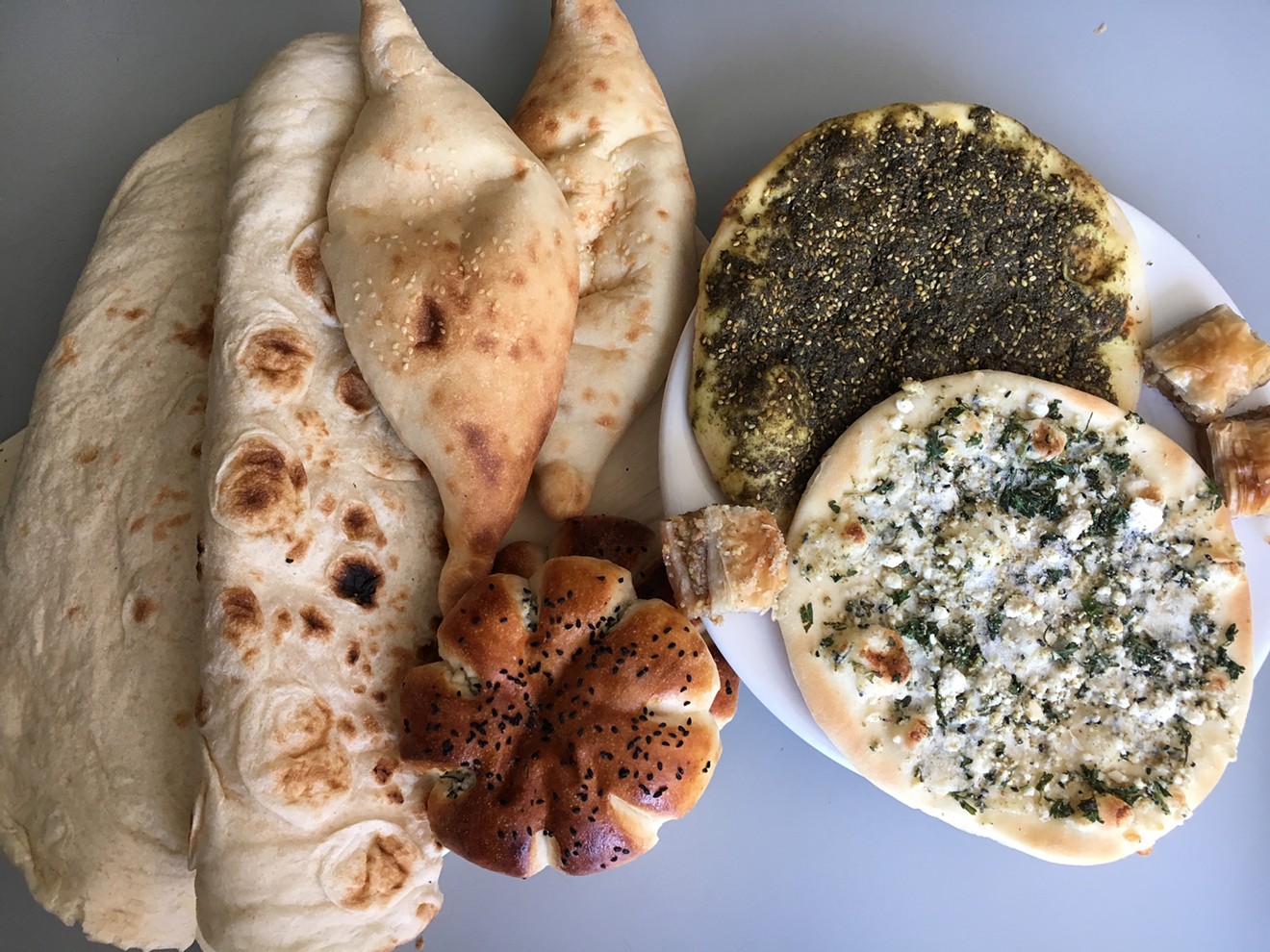 Flatbread, samoon, cheese-filled buns, baklava and pizza-like rounds called manakish are just a few of the baked goods available at Shahrazad.