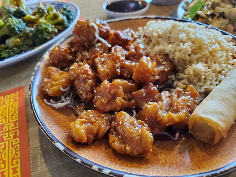 Image: small pieces of fried chicken on a plate with rice