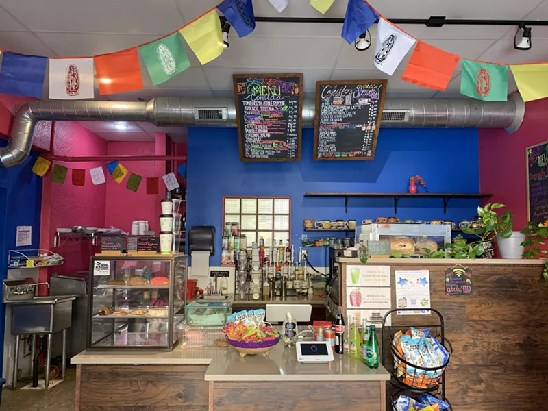 Image: a counter in a coffee shop with colorful walls