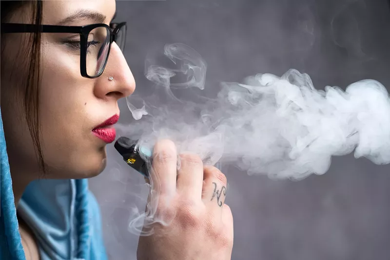 Image: A woman vaping