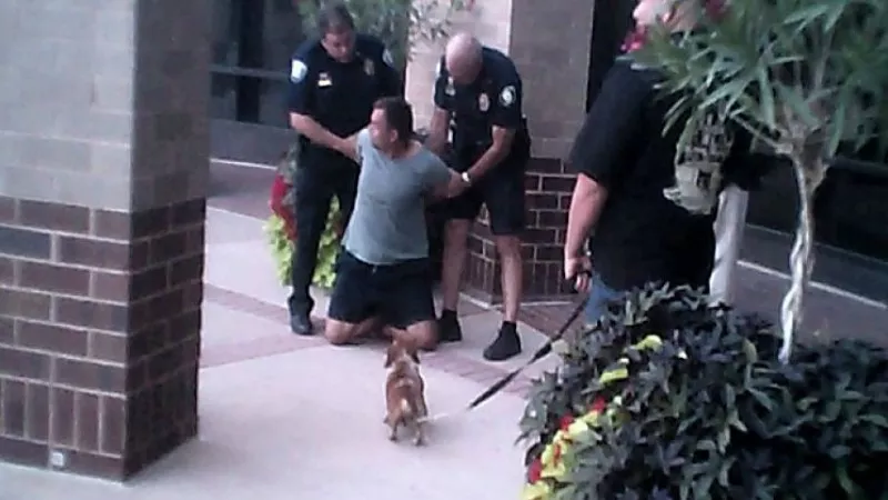 Image: A photo of Eric Brandt being arrested — a not-infrequent occurrence.