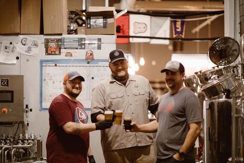 Blake Butler (center) will open Six Capital Brewing on March 15.