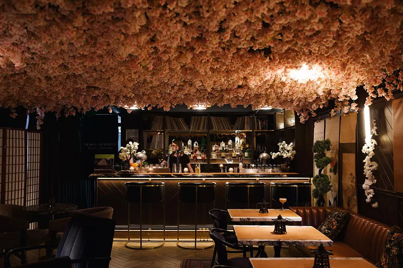Image: Cherry blossoms affixed to the ceiling of a bar