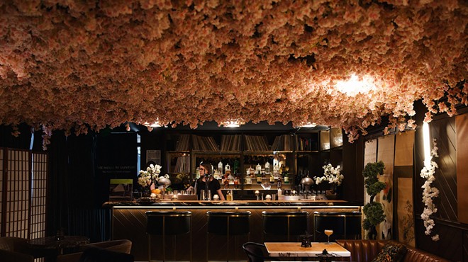 Cherry blossoms affixed to the ceiling of a bar