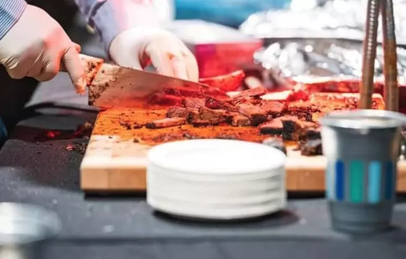 Image: BR Beef cutting up its Red Angus/Charolais strip loin, which was slow-cooked over charcoal and seasoned with sea salt, garlic and pepper.