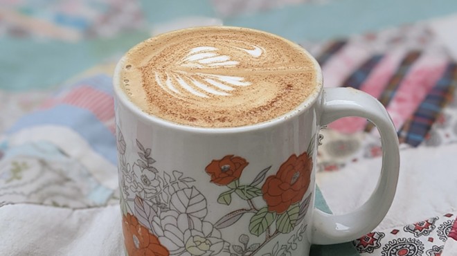 Latte art displayed in a printed mug