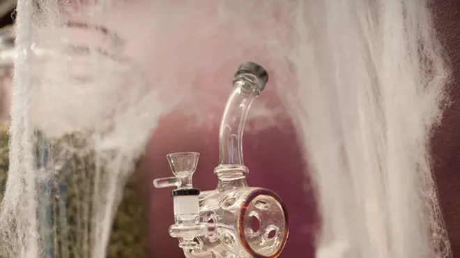 Bong surrounded by spider webs