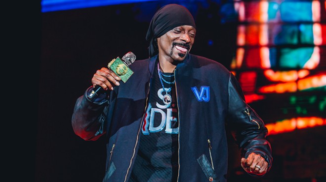 Snoop Dogg laughs on stage during a Colorado concert