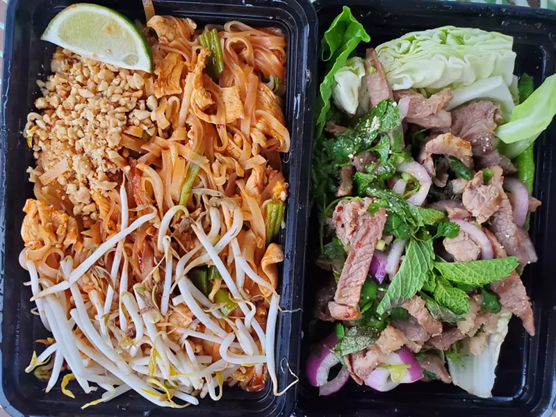 Image: two to-go boxes open and filled with food