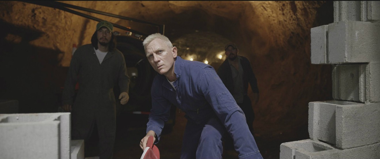 Daniel Craig, in a scene with Adam Driver (left) and Channing Tatum (right), plays Joe Bang, a fast-talking, hootin’ and hollerin’ jailbird, in Steven Soderbergh's Logan Lucky.