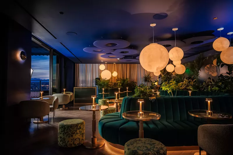 Image: teal booths inside a bar