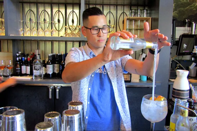 Image: Ultreia bar manager Alan Berger uses a bar spoon with a helical handle to create a "vortex" of tonic that mixes into the gin.
