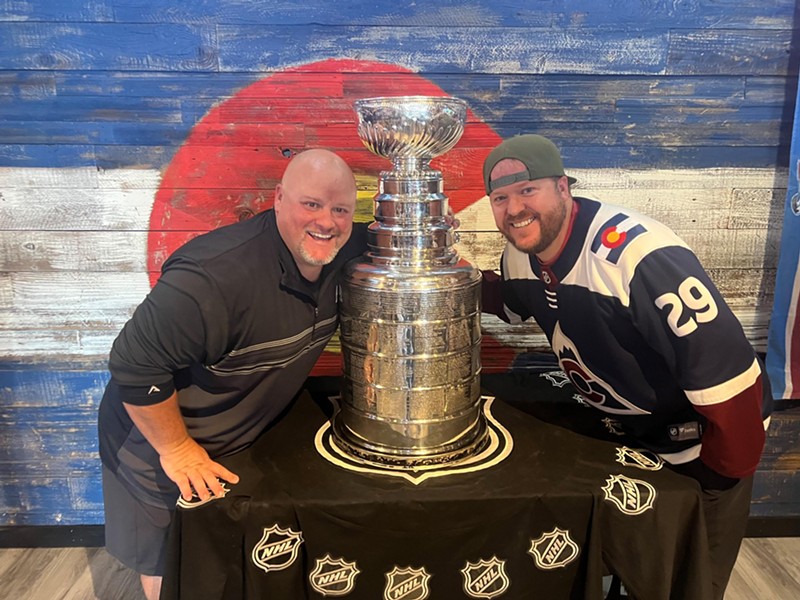 Judson Dymond (left) and Jeremy Malone with a Stanley Cup at their bar