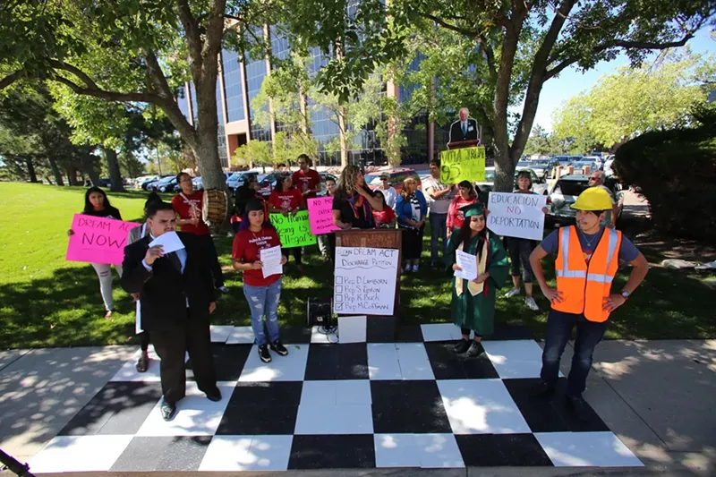 Image: DREAMers play human chess at Congressman Coffman's Office.