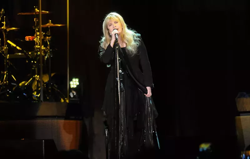 Image: stevie nicks singing on stage