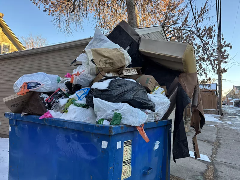Image: overflowing trash form dumpster