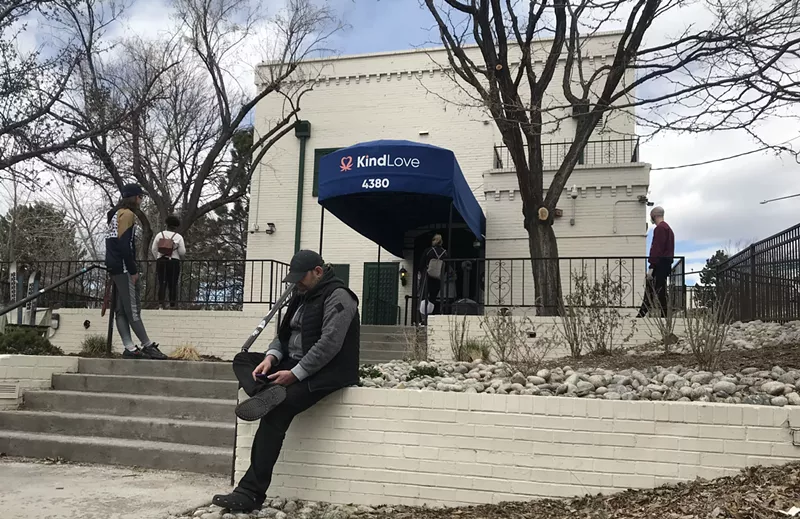 Image: Customers wait outside of Kind Love dispensary to pick up to-go orders on Wednesday, April 15.