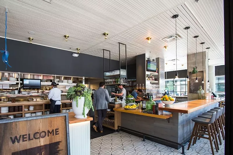 Image: The sign at the front of the restaurant reads "Welcome" — but the host is the one who helps you feel welcome.
