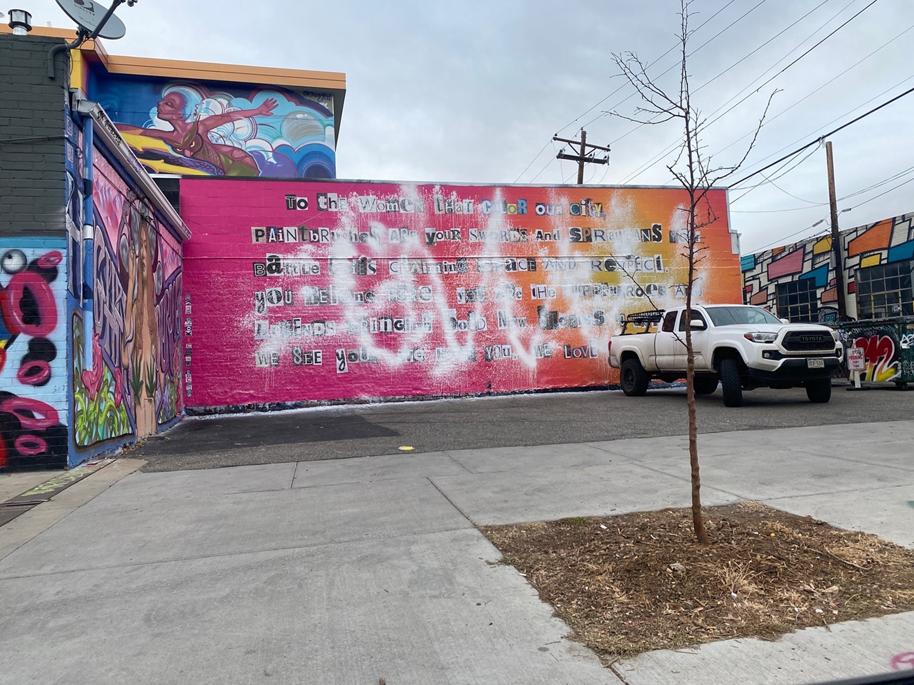 Shannon Galpin and Koko Bayer's mural on the side of American Bonded, vandalized.