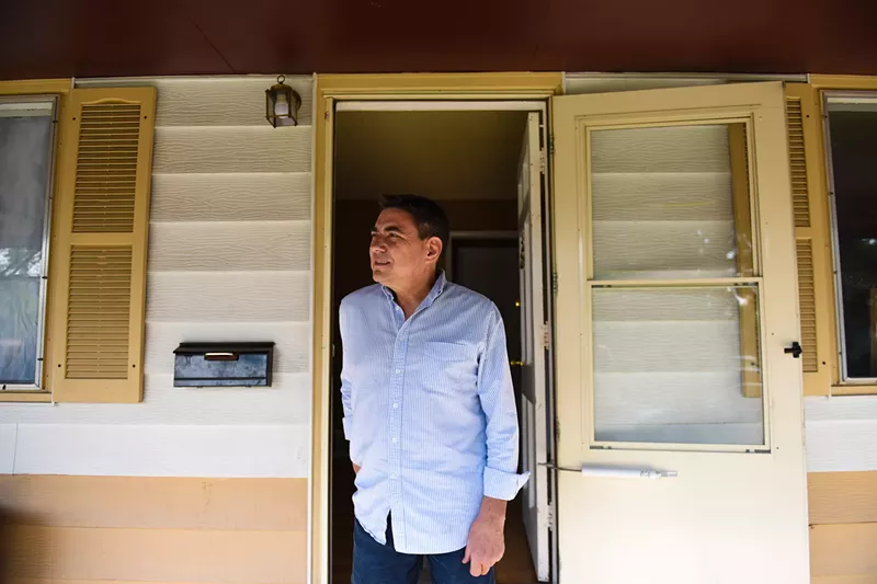 Image: Steve Schweid looks out from Asaad and Sabah's home.