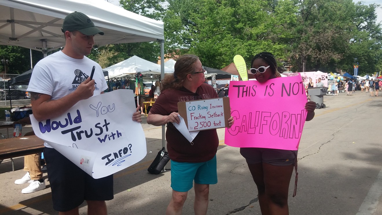 Fort Collins resident and Colorado Rising volunteer Liz Kekahbah, center, told reporters at a press conference on June 20 that counter-protesters were snapping photos of voters who signed her petition.