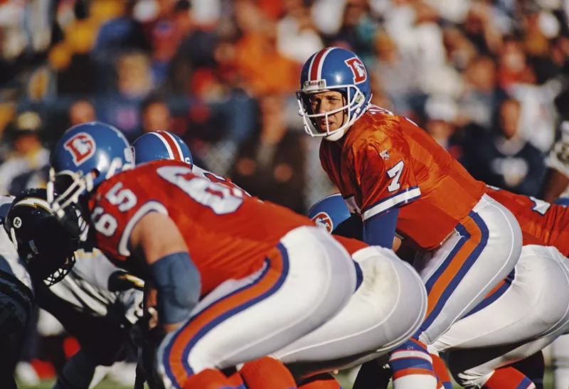 Image: John Elway in bright orange Broncos jerseys