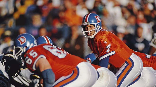 John Elway in bright orange Broncos jerseys