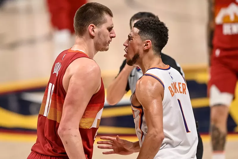 Image: Nikola Jokic of the Denver Nuggets and Devin Booker of the Phoenix Suns tangle in Game Four of the Western Conference second-round playoff series at Ball Arena in 2021