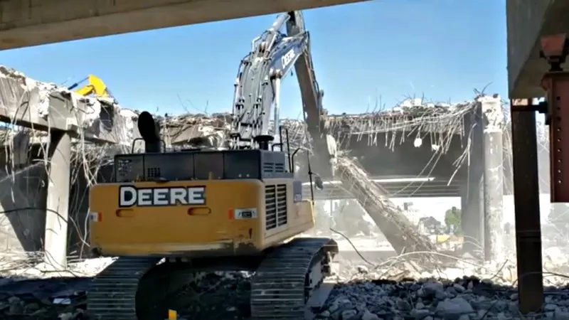 Image: In recent days, crews demolished portions of old I-70 over the Peoria Street bridge as part of the Central 70 project.