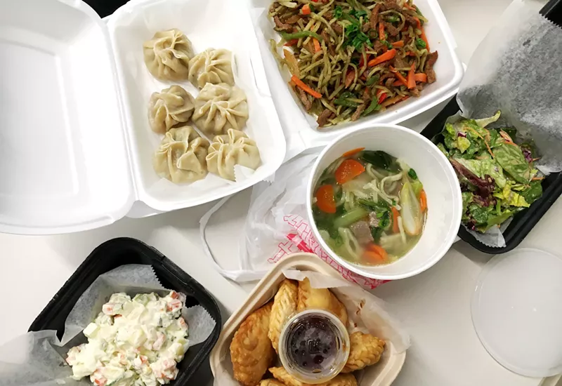 Image: A takeout bonanza from Sushi Kai & Mongolian Cuisine. Clockwise from top right: Tsuivan, side salad, lamb noodle soup, kuushuur, potato salad and buuz.