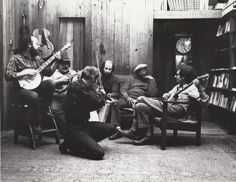 Image: A late-’60s photo of the Denver Folklore Center. Left to right: Steve Weincrot, David Ferretta (mandolin), Larry Sandburg, Harry Tuft, Wesley Westbrooks, and Dick Weissman.