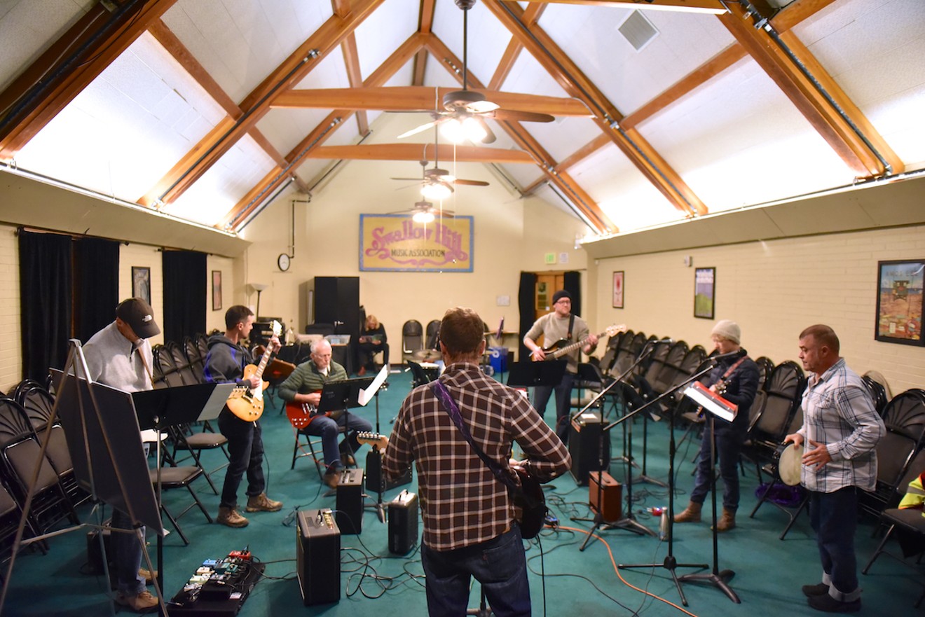 Swallow Hill Instructor Jeff Rady leads a rock ensemble in Tuft Theatre at Swallow Hill Music's Yale Avenue location, fall 2018.