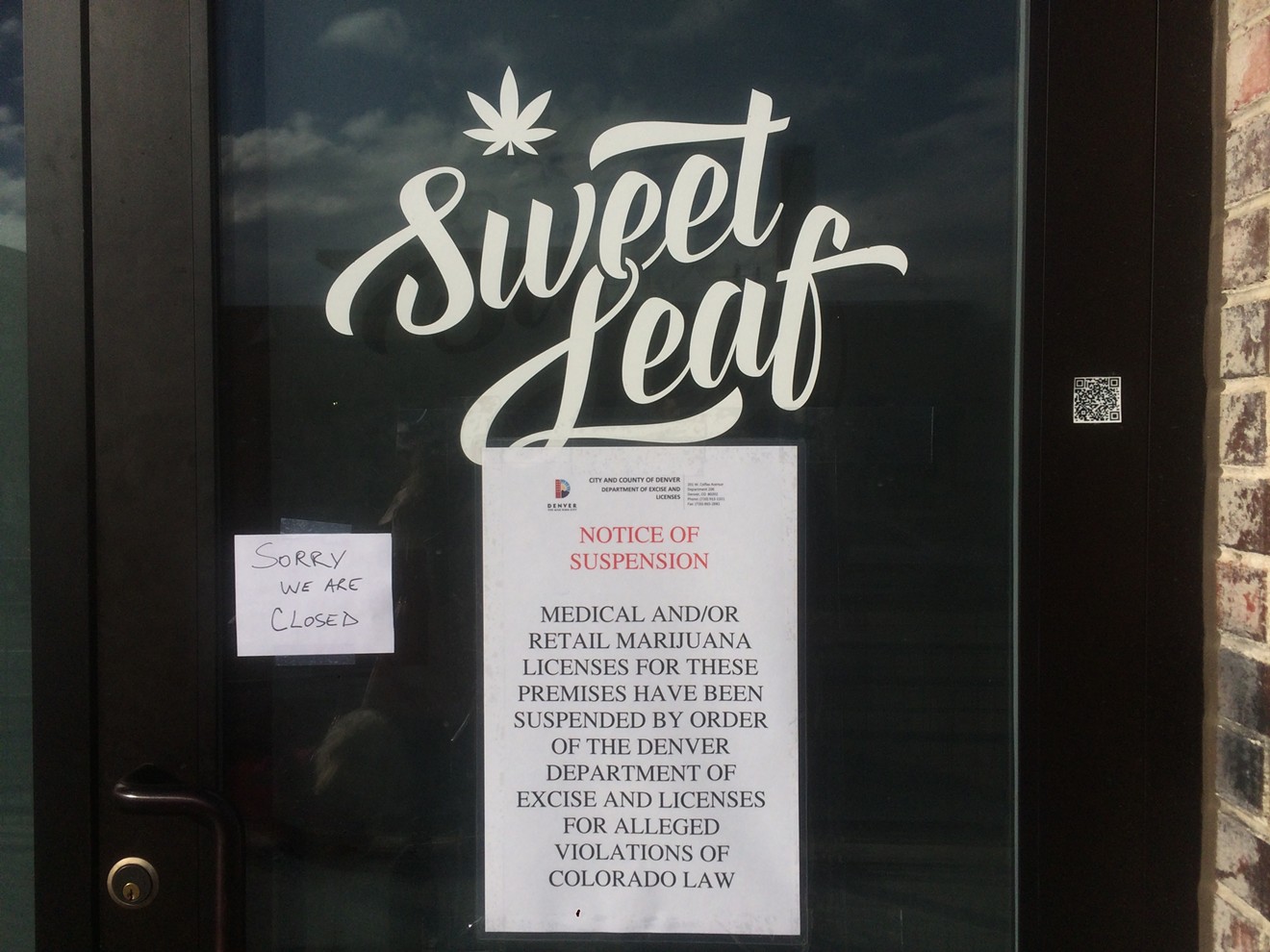 A sign at Sweet Leaf's Walnut Street dispensary announces the store's license suspension.