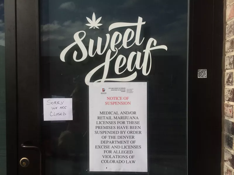Image: A sign at Sweet Leaf's Walnut Street dispensary announces the store's license suspension.