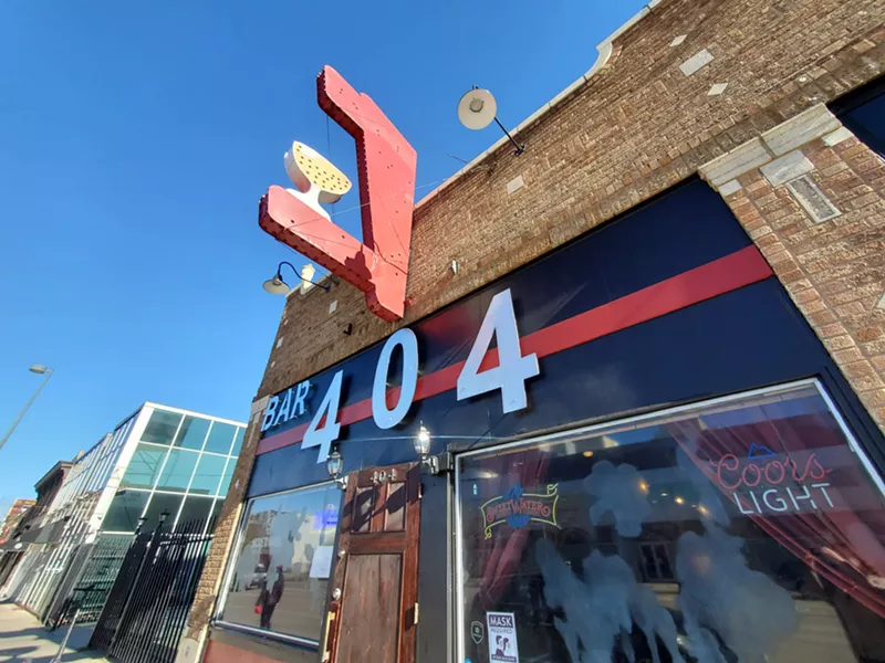 Image: Bar 404's windows are damaged from spray paint that contained acid.