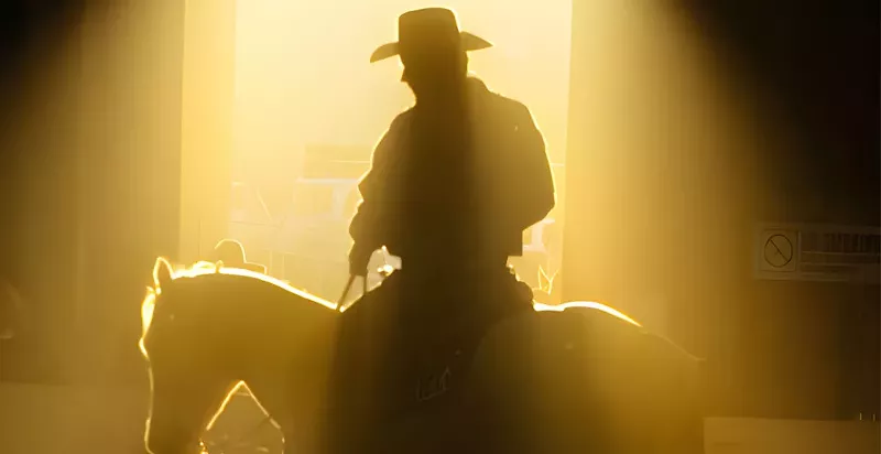 Image: cowboy on horse silhouette