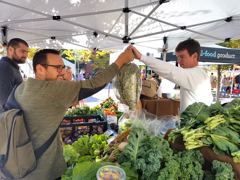 Image: Chef Brian Wilson of Beast + Bottle getting goods from Christian Toohey of Toohey & Sons Organic.