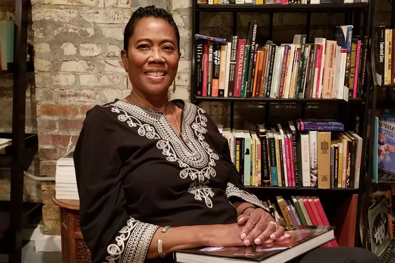 Image: Risë Jones inside her new tea shop and bookstore, TeaLee's.