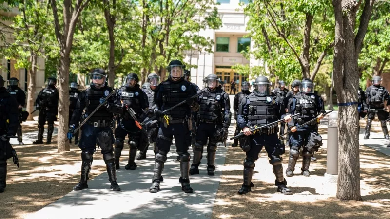 Image: Aurora Police Department officers in formation.