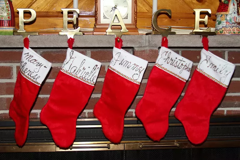 Image: Christmas stockings are made from glitter and glue and felt and anticipation.
