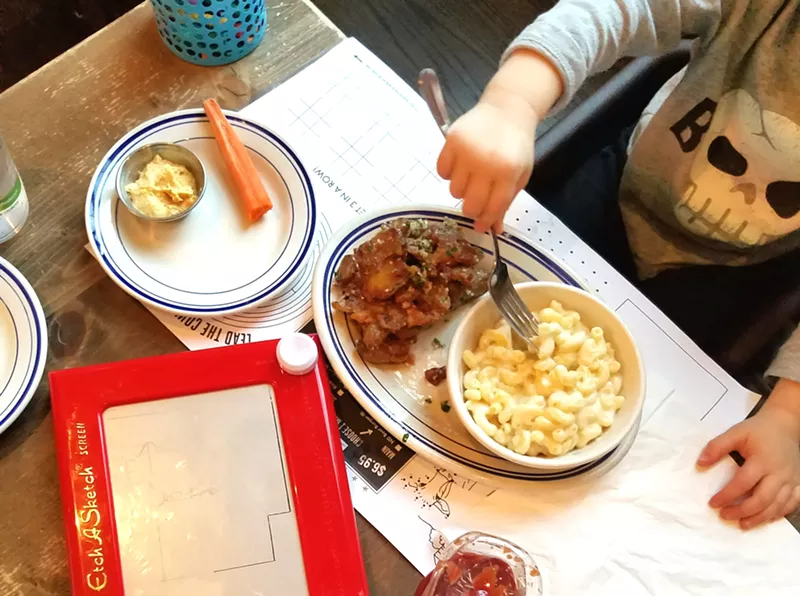 Image: Etch A Sketch and macaroni and cheese, a great kid combo at Next Door American Eatery in Union Station.