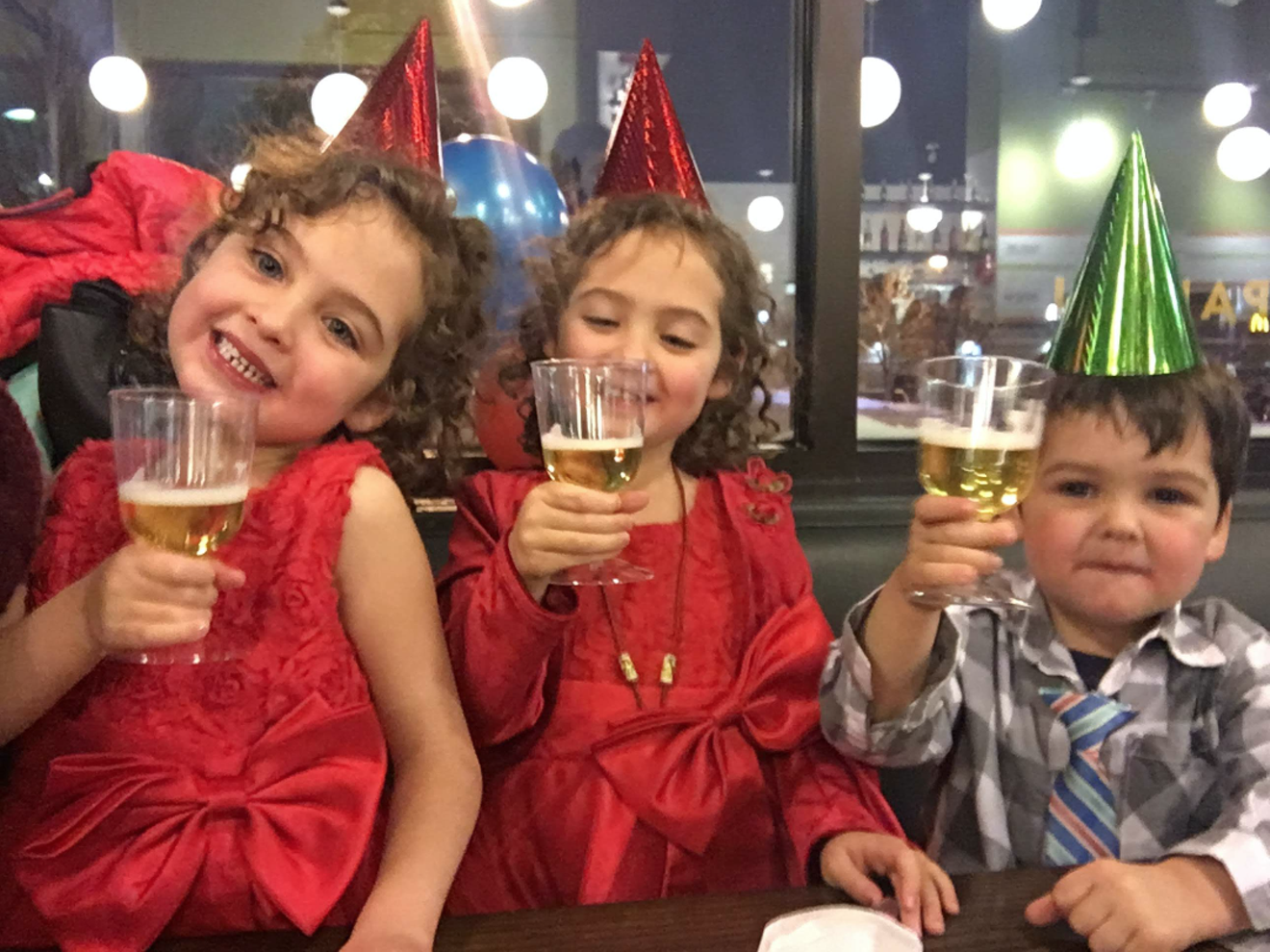 Kids celebrating New Year's Eve at Mici.