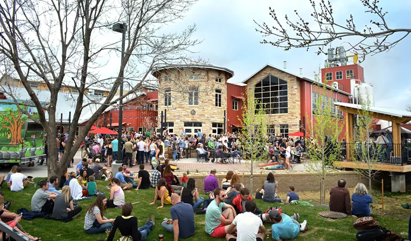 Image: people sit outside a brewery