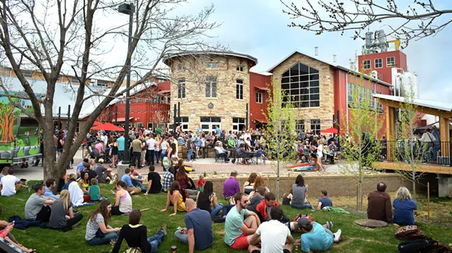 people sit outside a brewery